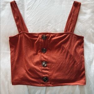 Orange cropped tank top.